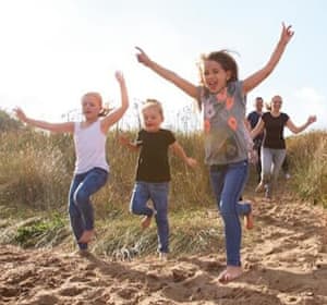Family heading for fun on the beach