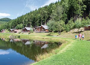Family enjoying summer stroll at Penvale Lakes Lodges