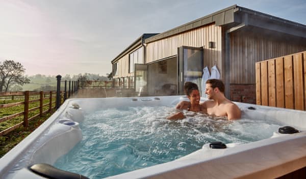 Couple enjoying hot tub in the outdoors
