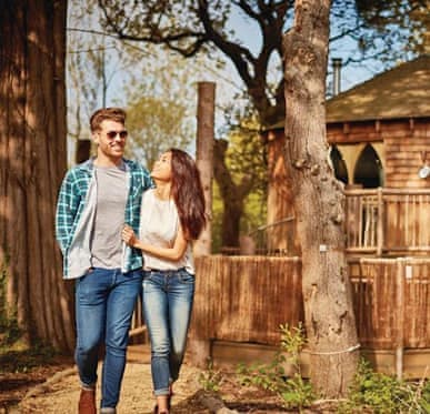 Couple enjoying woodland walk