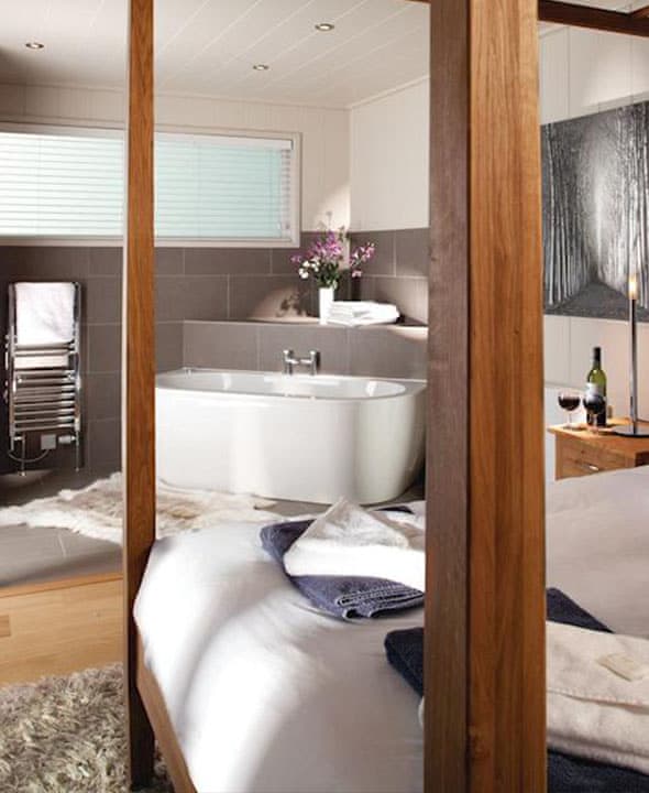 Beautiful couples lodge with open plan bedroom and bathroom.